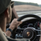 Person Driving A Porsche